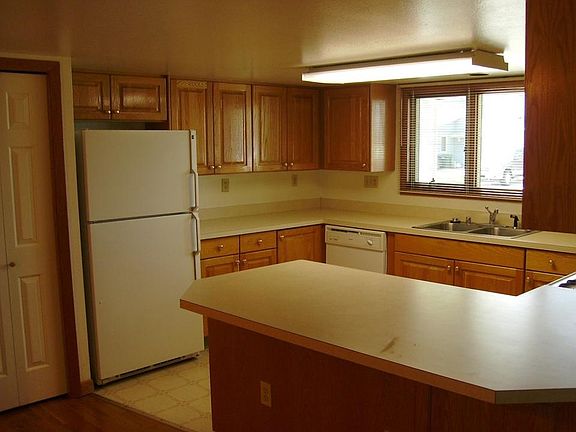 Kitchen space with lots of cabinets and a pantry