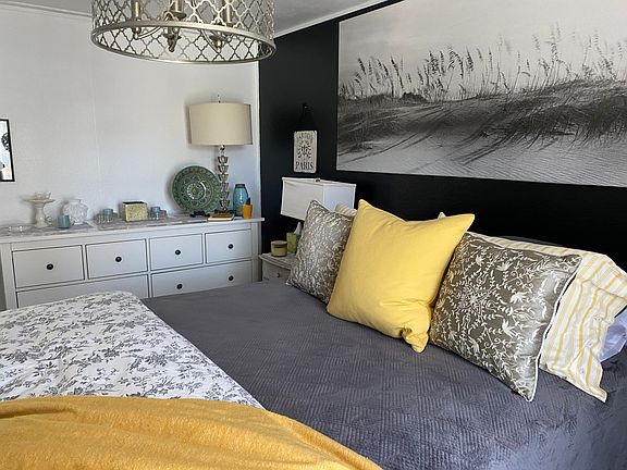 Dresser has 8 drawers, good size closet, blackout drapes that open to the front yard.