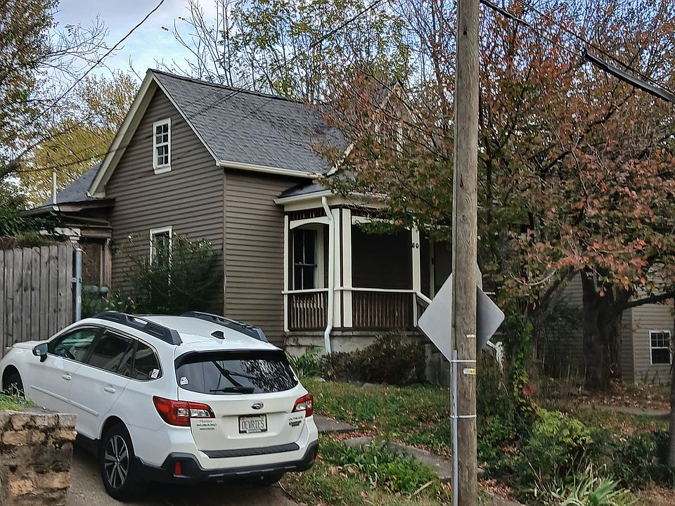 Street front, driveway at rear of house