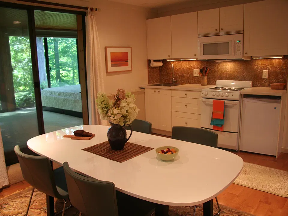 Fully equipped Ikea Kitchen and dining area seats six. Stand-up refrigerator in garage provides additional food storage. Not sho