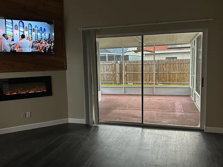 Electric fireplace and large glass windows keeping this place bright.