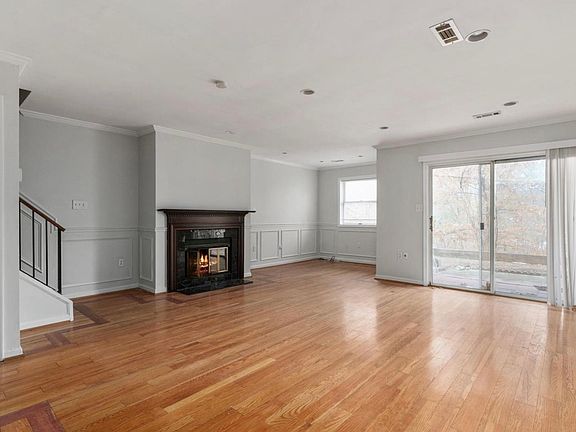 Living room with hardwood floors and fireplace