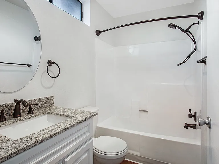 Renovated bathrooms with quartz countertops