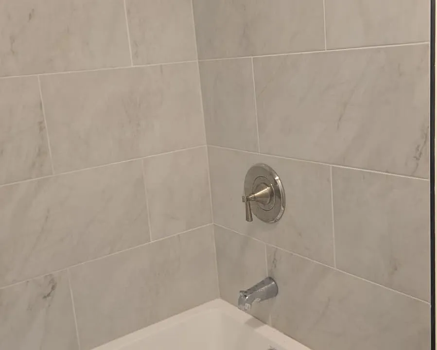 New bathtub, tiles and fixtures.