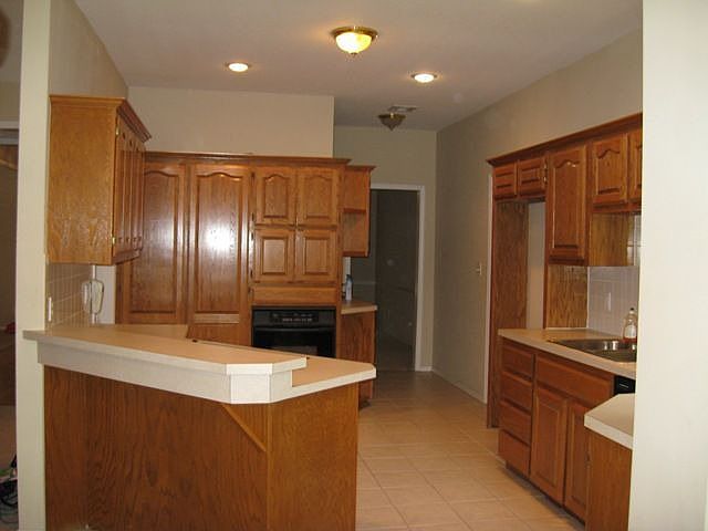large kitchen opens to 2nd living