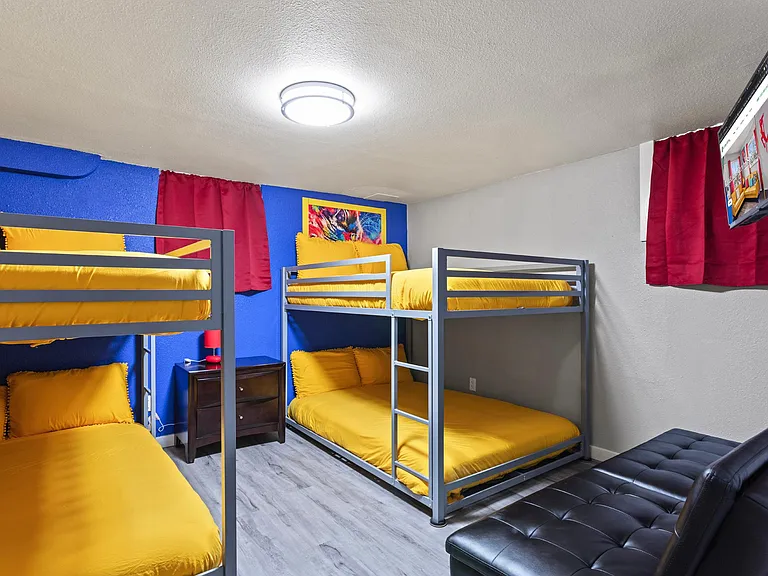 Group Getaway Central _ Enjoy a fantastic stay in our room with two double-sized bunk beds and a smart TV for entertainment, perfect for friends or family!