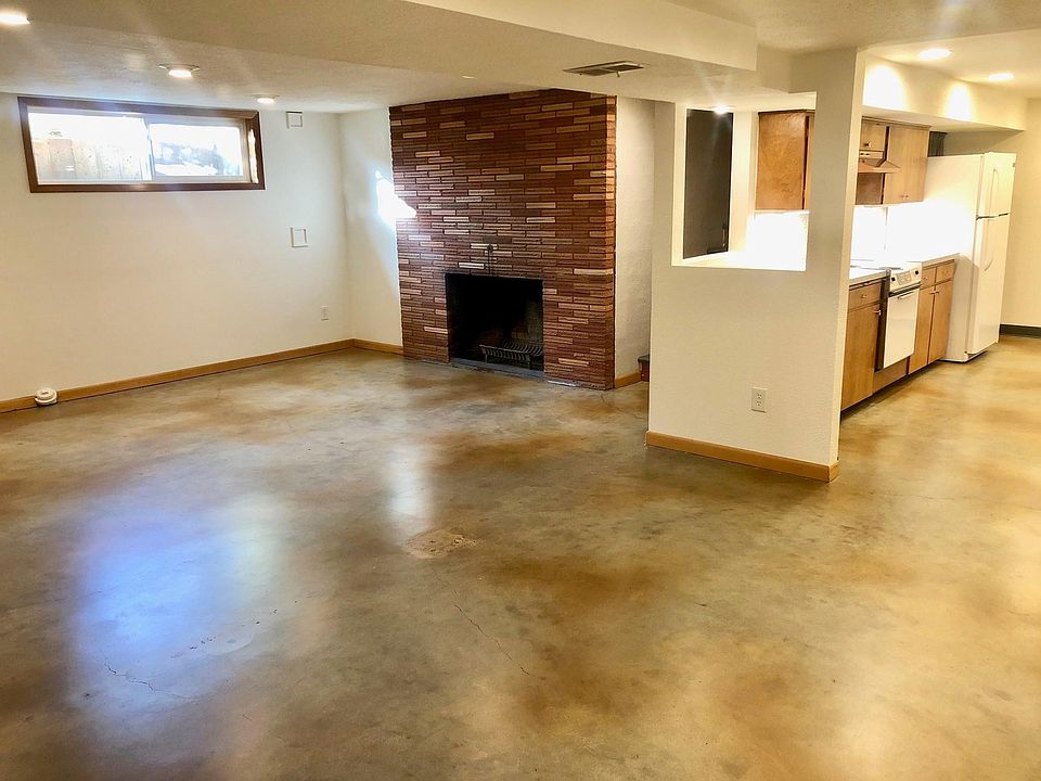 Bright and open floor plan. High ceilings. Kitchen with pass through bar to dining/living room. Fireplace for decoration. Sorry, no fires.
