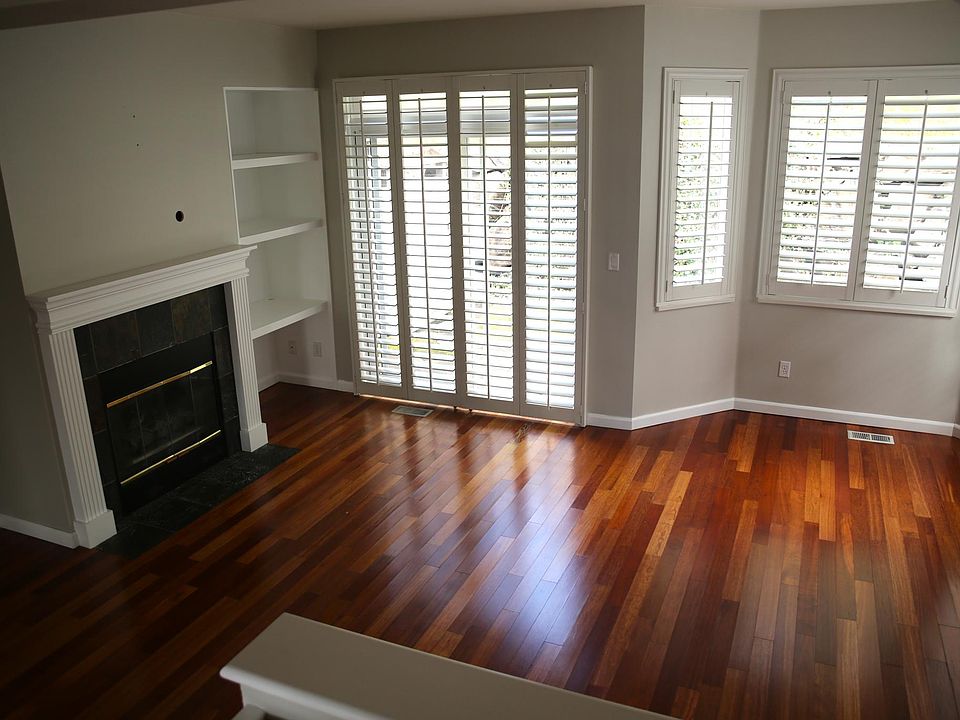 Open living room with sliding door into private back yard
