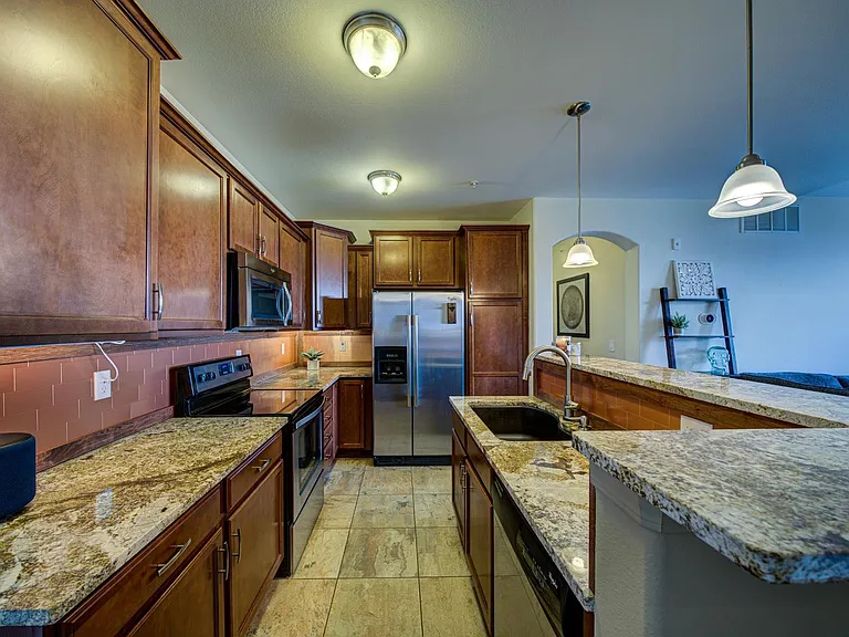 Extra high kitchen cabinets. Granite countertops.