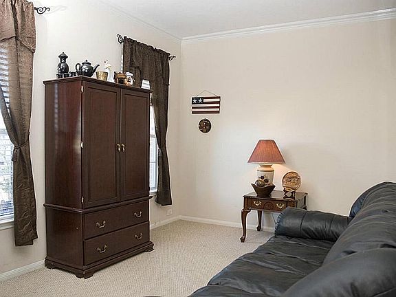 This floorplan offers both formals. Here is the formal living room which could also double as a great study / home office space. Light and bright plus crown molding too.