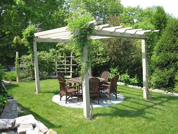 Another view of the pergola-covered sitting area.