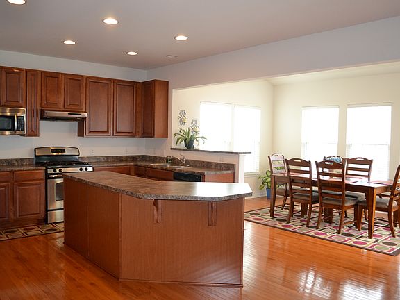 Open floor plan with upgraded kitchen featuring oversized island.