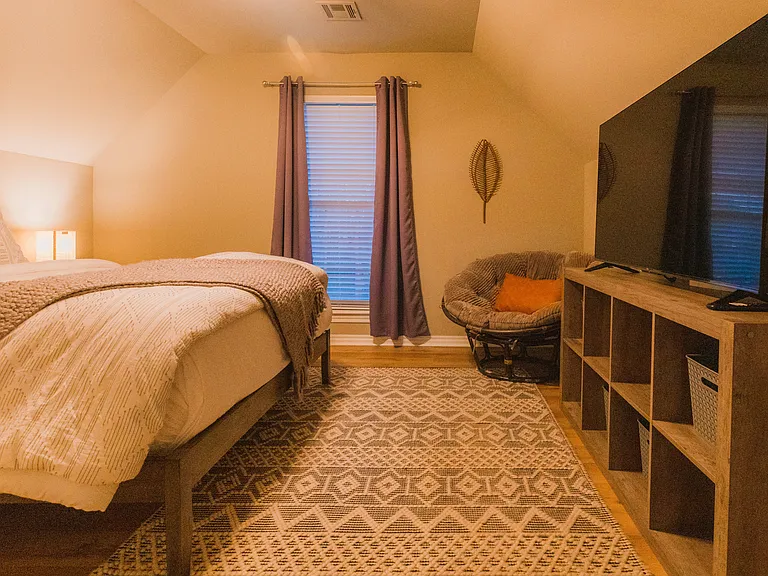 Queen bedroom upstairs. Black out curtains. Mattress topper for comfort.