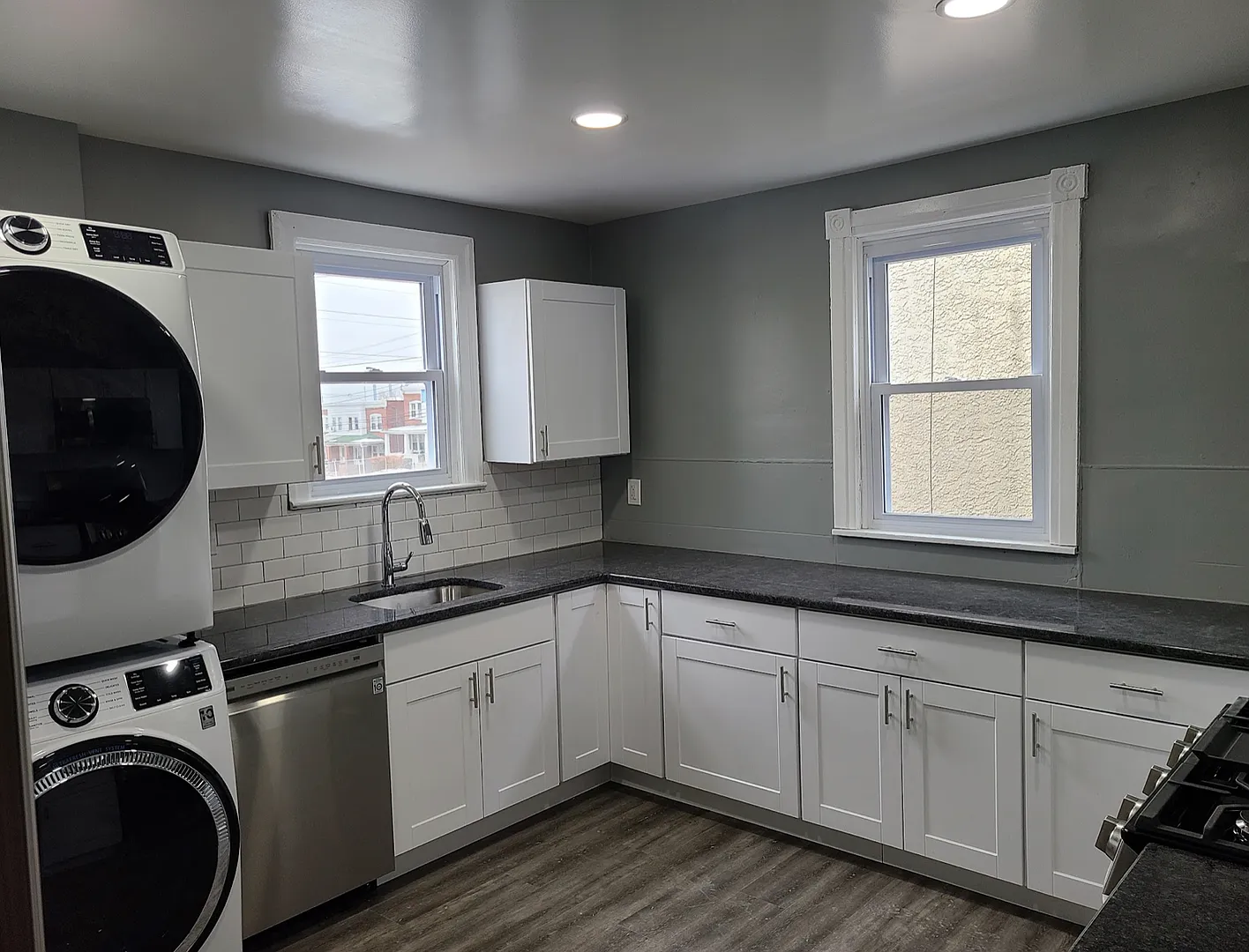 Twin home with updated kitchen, washer/dry on first floor, private back yard and porch. — Photo 3