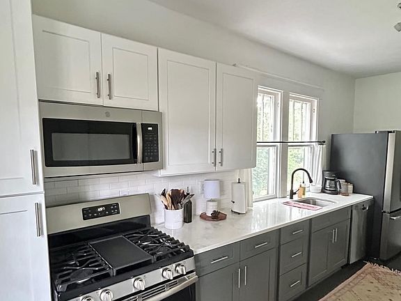 Quartz countertops, stainless-steel appliances, gas stove