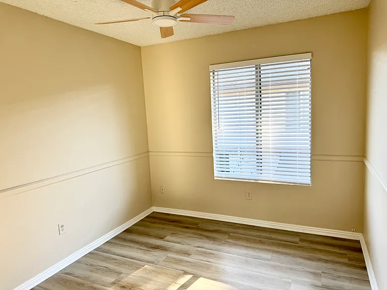 3rd Bedroom with mirror closet and new ceiling fan