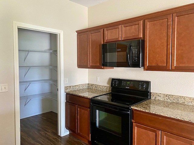 Kitchen has granite countertops, Frigidaire appliances and walk in pantry.