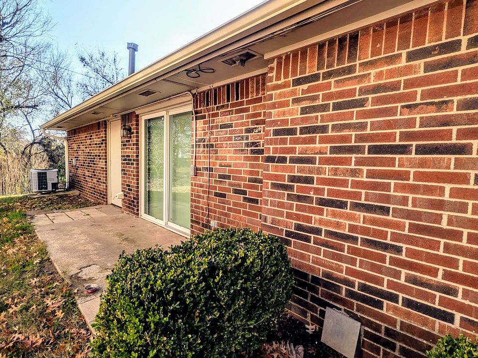 View of sliding glass door and patio on North Side of residence