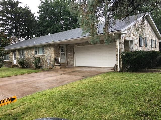 Beautiful flagstone rancher, with two car attached garage.
