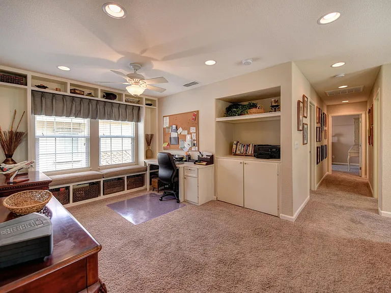 loft with built-in desk and window seat