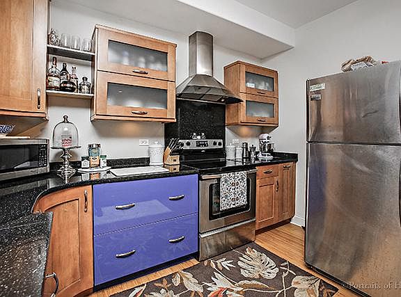 Well-appointed kitchen with granite countertops and range ve