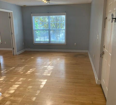 Livingroom facing the community tennis court