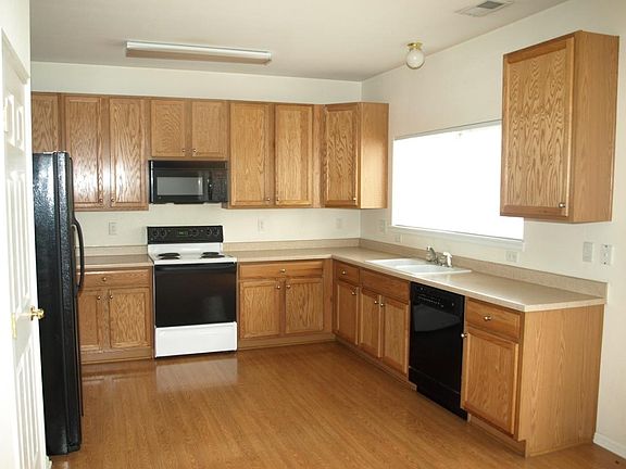 Kitchen is adjacent to Large eating nook and patio door out