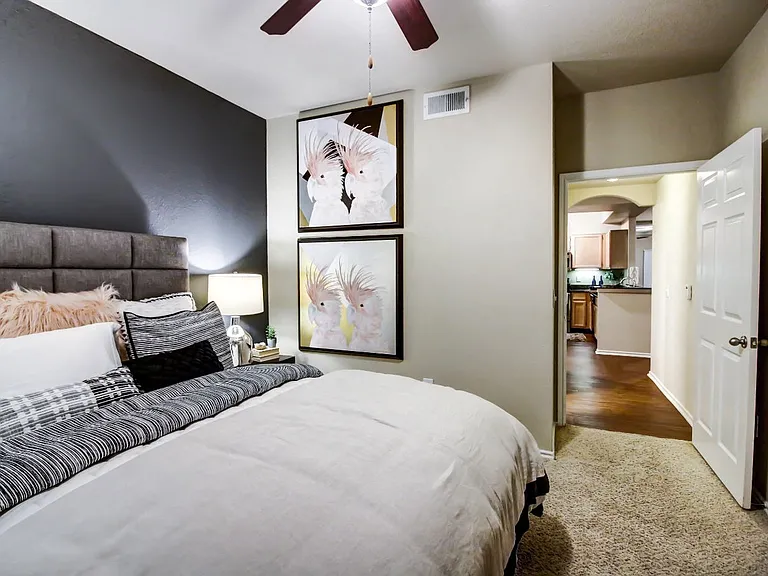 Spacious bedrooms with large windows for natural lighting, ceiling fan and plush carpet