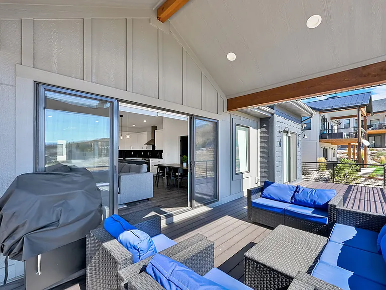 Outside deck with patio furniture and grill