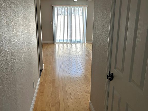 Enter into a hallway leading to the living area and kitchen