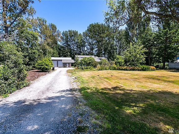 Mature landscaping surrounds the property
