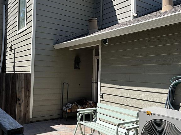 Entry way showing fire wood rack adjacent to front door.