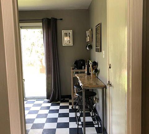 Kitchen with slider to the back yard and door to the garage.