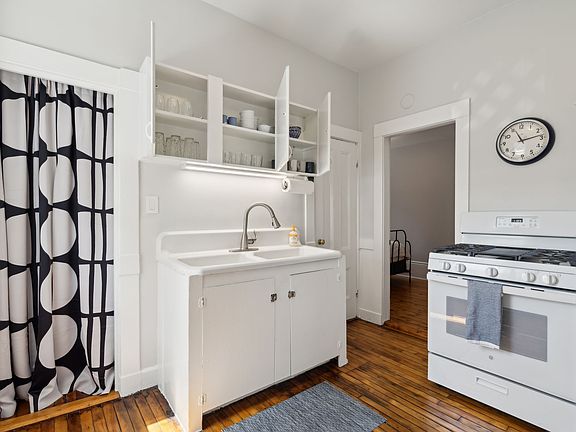 Kitchen with farm sink and gas stove