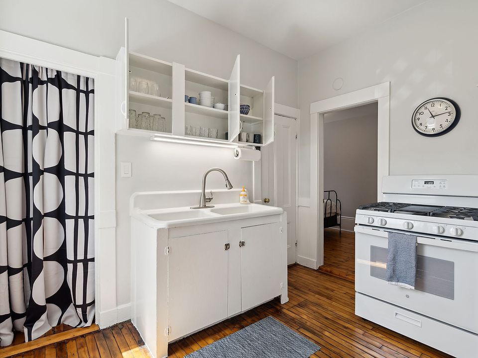 Kitchen with farm sink and gas stove
