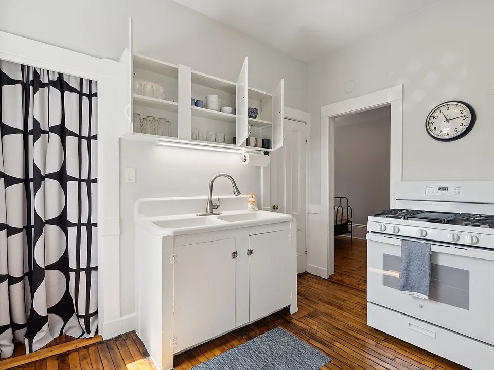 Kitchen with farm sink and gas stove
