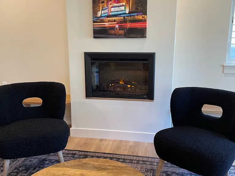 Electric fireplace with option for heat/blower or flame only.