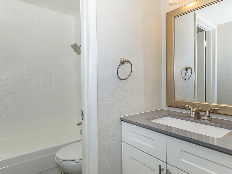 Explore this modern bathroom oasis, designed with elegance and functionality in mind.