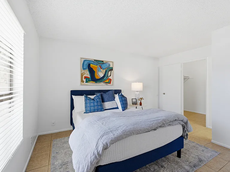 Expansive primary bedroom offers a peaceful and inviting atmosphere.