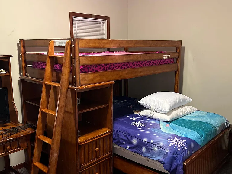 4th Bedroom on 2nd floor. Currently had twin bunk on top and full bed on bottom but they have been separated. And the entire top bunk and shelves will be removed.