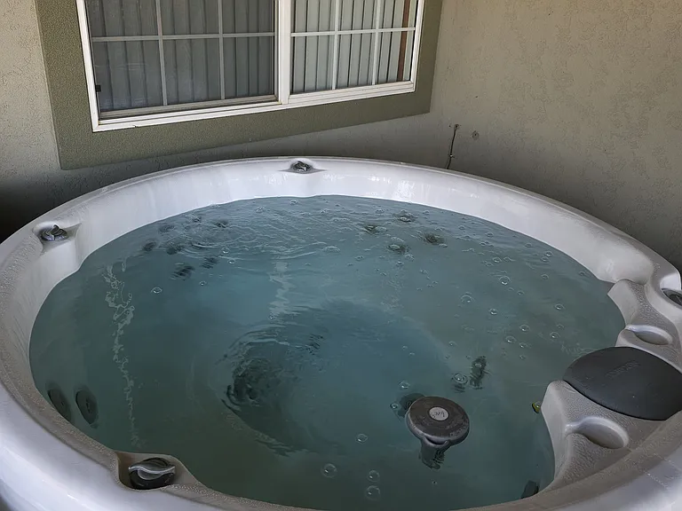 4-person hot tub on covered patio