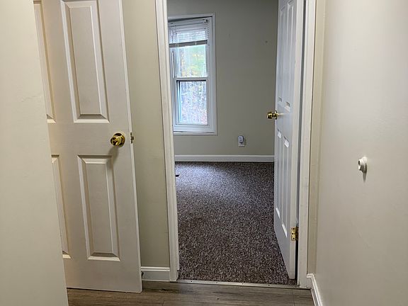 Turn to the right as you go through front door and you will find the first bedroom and a 3/4 bath.