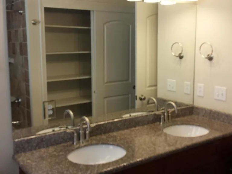 Hall bath: twin sinks with large linen closet
