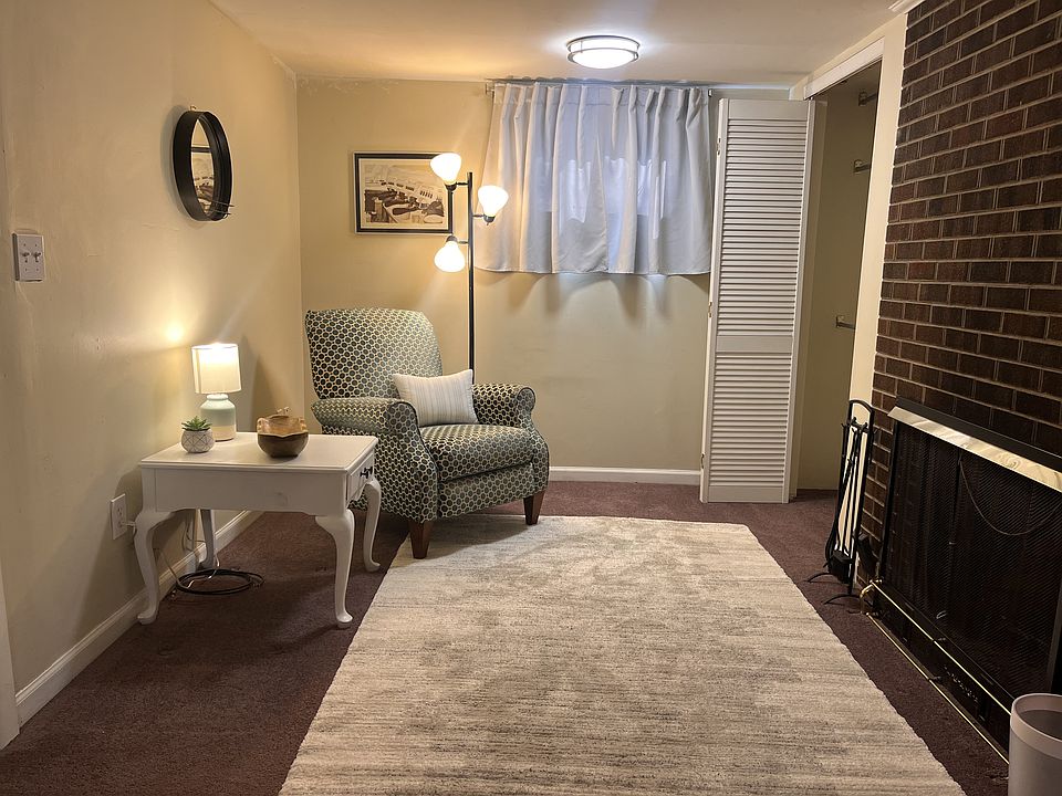 Seating area and closet with green velvet La-Z-Boy recliner