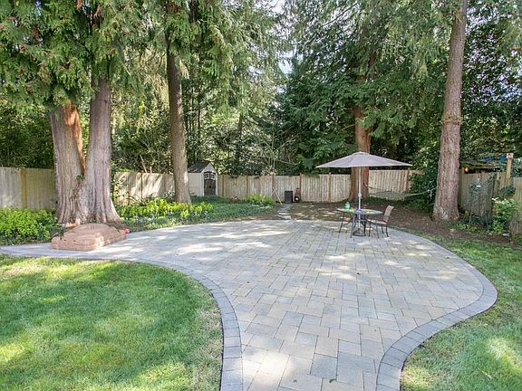 Spacious yard with patio, hammock & storage shed