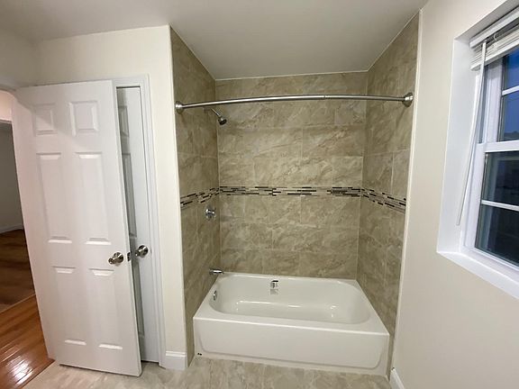 Hallway bathroom with linen closet
