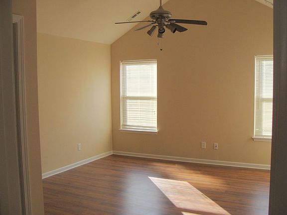 New neutral paint & new laminate wood floor in living room.