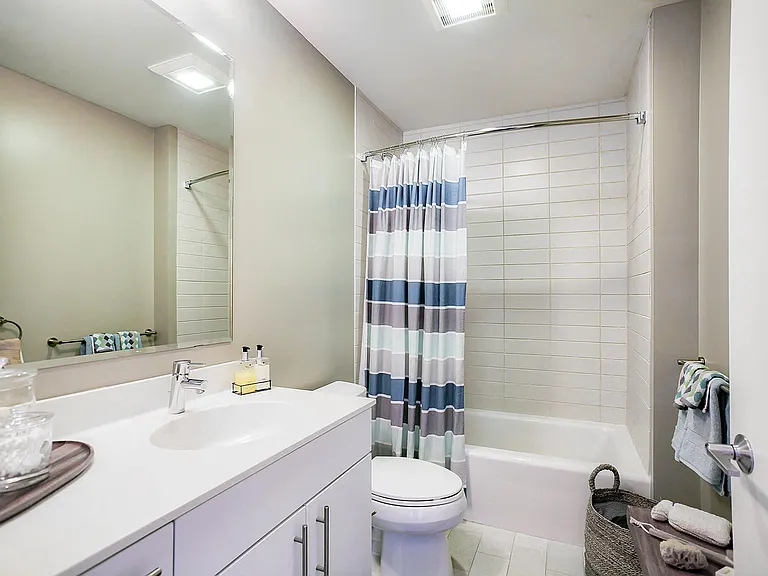 Luxury bathrooms featuring modern fixtures, and soaking tubs with tile tub surrounds