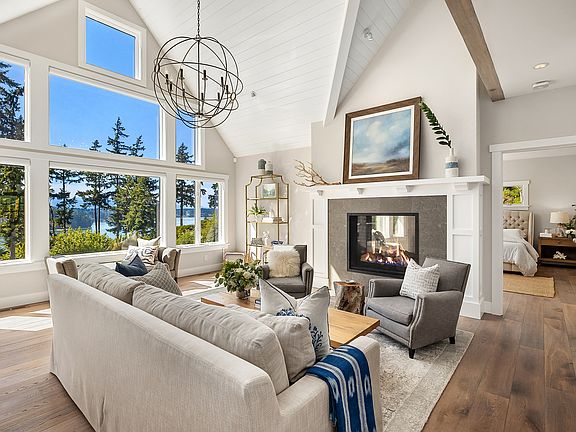 
                    Vaulted tongue & groove ceilings & massive windows w/view.
                