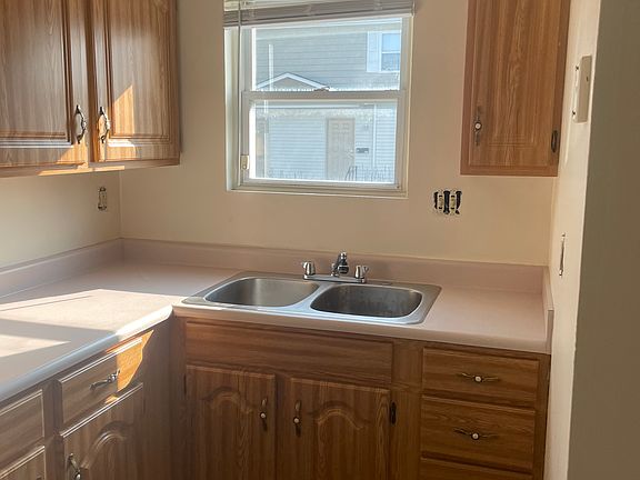 KITCHEN: Not current photo (older flooring shown & outlet covers not installed at that time)
